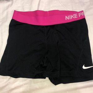 Black Nike Pro Shorts with a pink waistband
